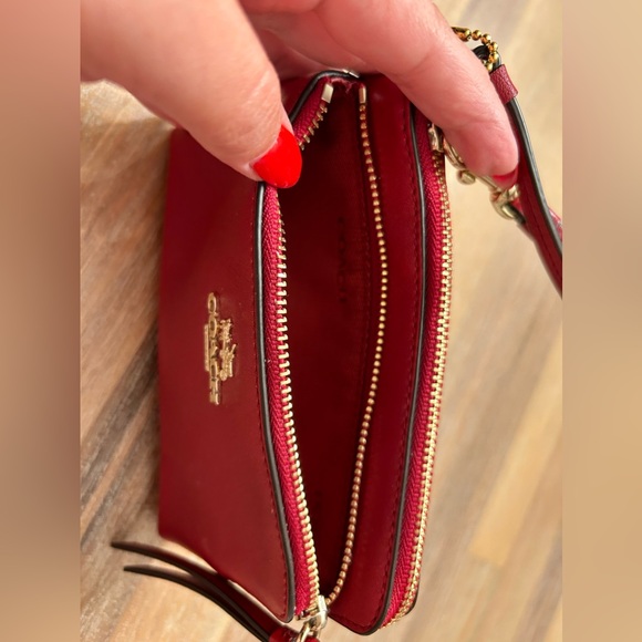 Coach burgundy wallet with gold accents. Wrist strap. Never used. - Picture 2 of 5